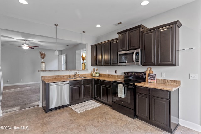 kitchen featuring pendant lighting, sink, ceiling fan, appliances with stainless steel finishes, and kitchen peninsula