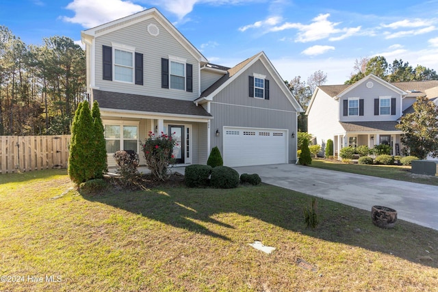 view of front property with a garage and a front lawn