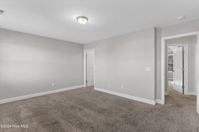 spare room featuring carpet flooring