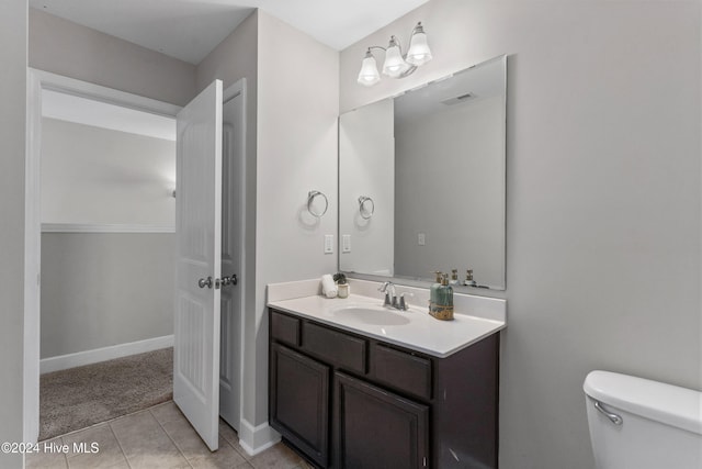 bathroom with tile patterned floors, vanity, and toilet