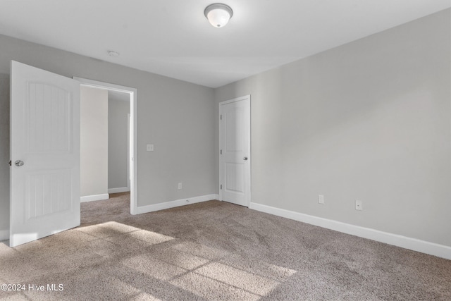 unfurnished bedroom with carpet floors