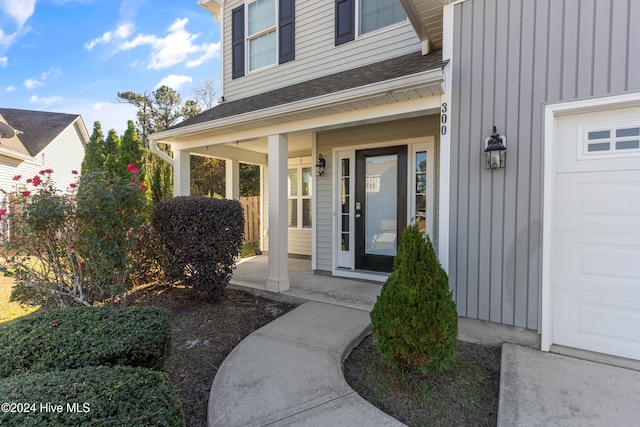 view of exterior entry featuring a garage