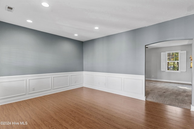 spare room featuring hardwood / wood-style flooring