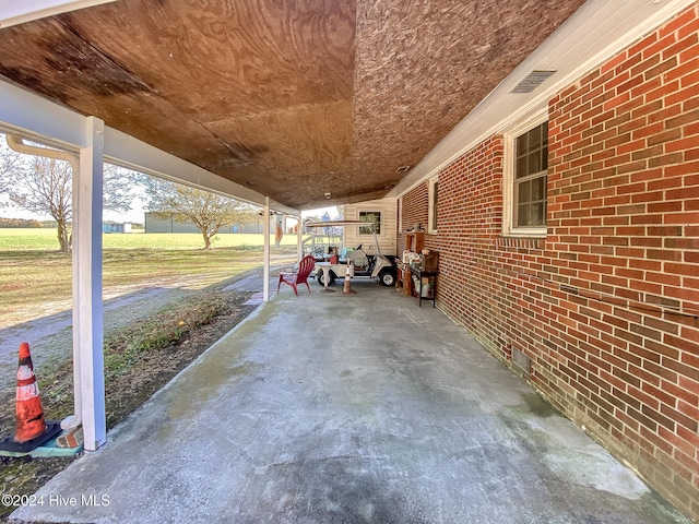 view of patio / terrace with a carport