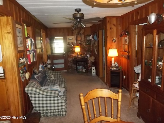 4271 Caratoke Hwy, Barco, NC 27917 - living area with wood walls, a ceiling fan, and carpet flooring