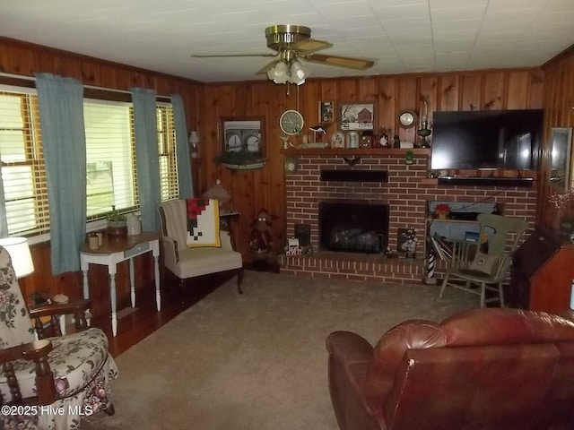 4271 Caratoke Hwy, Barco, NC 27917 - living room with a fireplace, wood walls, ceiling fan, and carpet floors