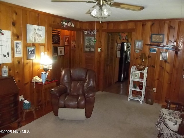 4271 Caratoke Hwy, Barco, NC 27917 - sitting room featuring wooden walls, ceiling fan, and carpet flooring