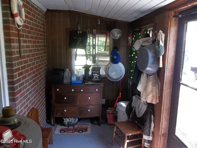 4271 Caratoke Hwy, Barco, NC 27917 - living area featuring brick wall, wood walls, and wooden ceiling