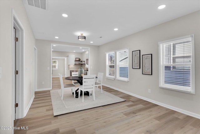 dining area with light hardwood / wood-style flooring