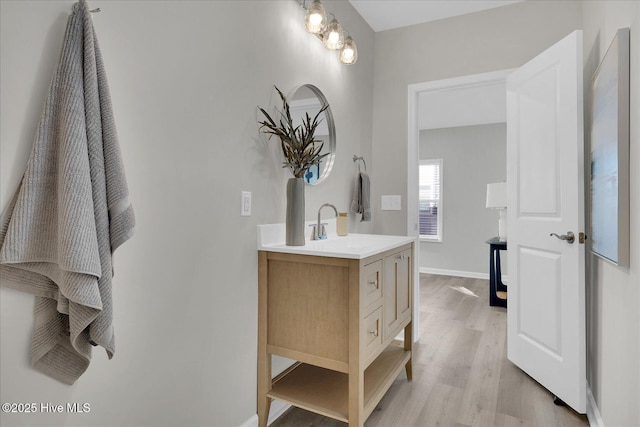 bathroom featuring vanity and wood-type flooring