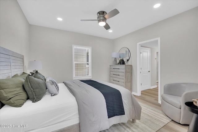 bedroom featuring light hardwood / wood-style floors and ceiling fan