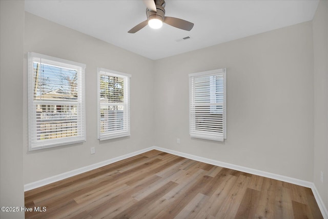 unfurnished room featuring ceiling fan and light hardwood / wood-style floors