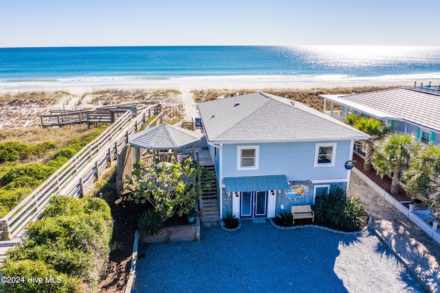 bird's eye view featuring a beach view and a water view