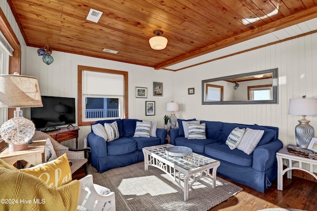 living room with wooden ceiling, wood-type flooring, wood walls, and ornamental molding