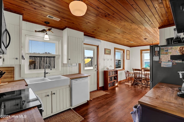 kitchen featuring white cabinetry, hanging light fixtures, dark hardwood / wood-style floors, wood ceiling, and appliances with stainless steel finishes