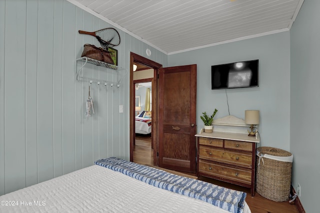 427 N Anderson Blvd, Topsail Beach, NC 28445 - bedroom with ornamental molding, wood finished floors, and baseboards