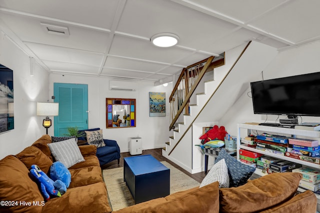 living room with hardwood / wood-style flooring and a wall mounted AC