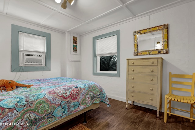 bedroom with dark hardwood / wood-style flooring and cooling unit