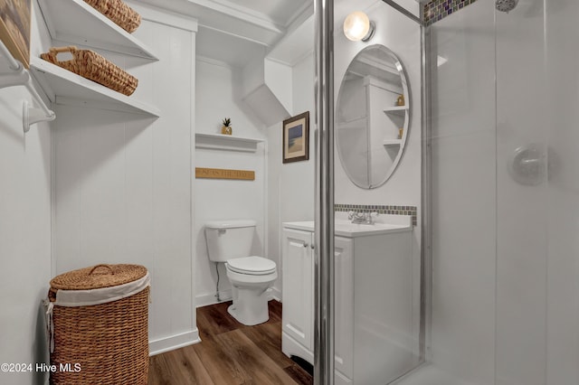 bathroom with wood-type flooring, vanity, and toilet