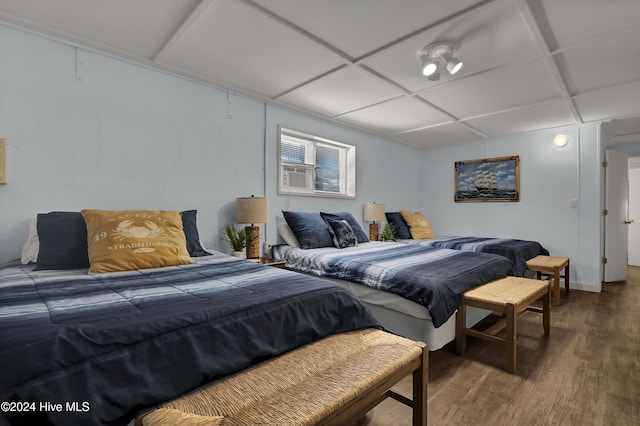 427 N Anderson Blvd, Topsail Beach, NC 28445 - bedroom with wood finished floors, coffered ceiling, baseboards, and cooling unit