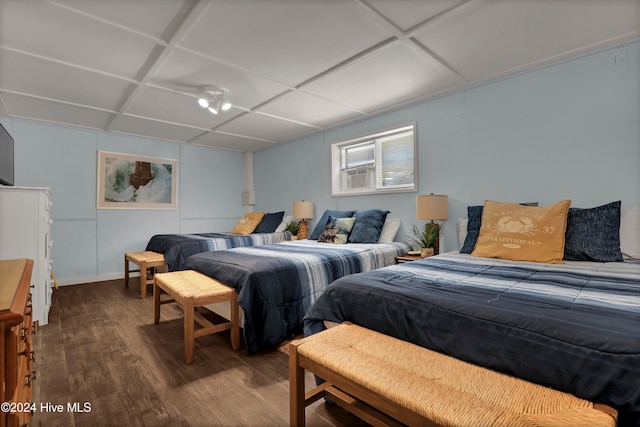 bedroom featuring hardwood / wood-style flooring and coffered ceiling