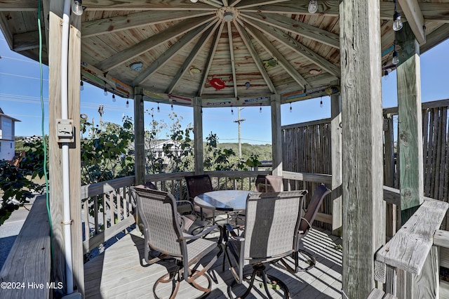 wooden terrace with a gazebo