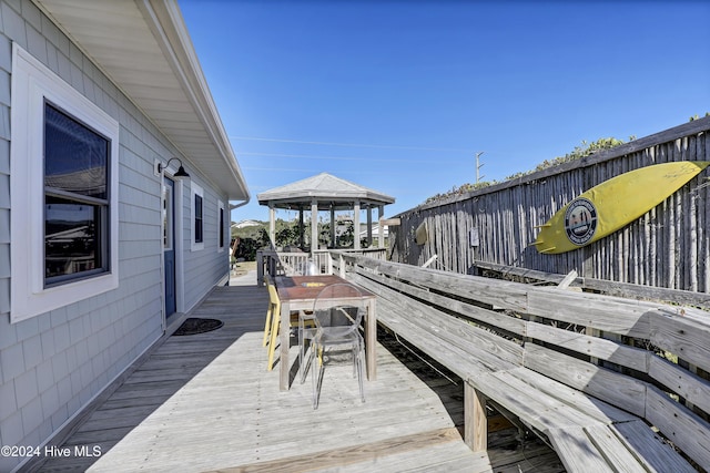 427 N Anderson Blvd, Topsail Beach, NC 28445 - wooden deck featuring a gazebo and outdoor dining area