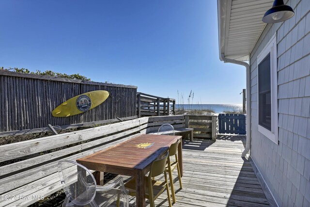 427 N Anderson Blvd, Topsail Beach, NC 28445 - wooden deck with a water view and outdoor dining area