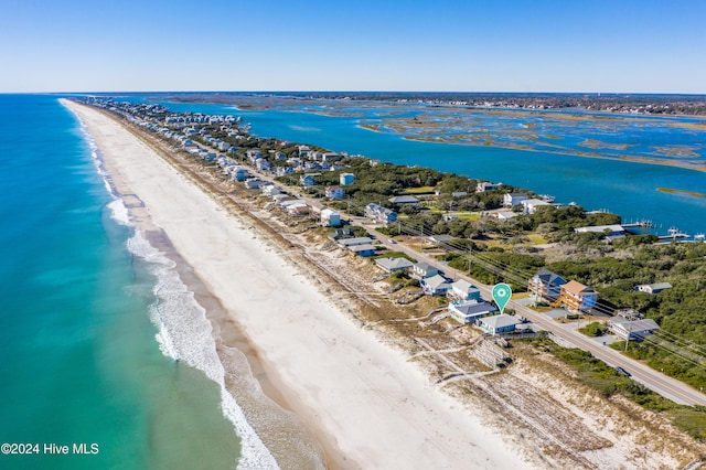 aerial view featuring a water view and a beach view