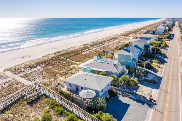 aerial view featuring a water view and a view of the beach