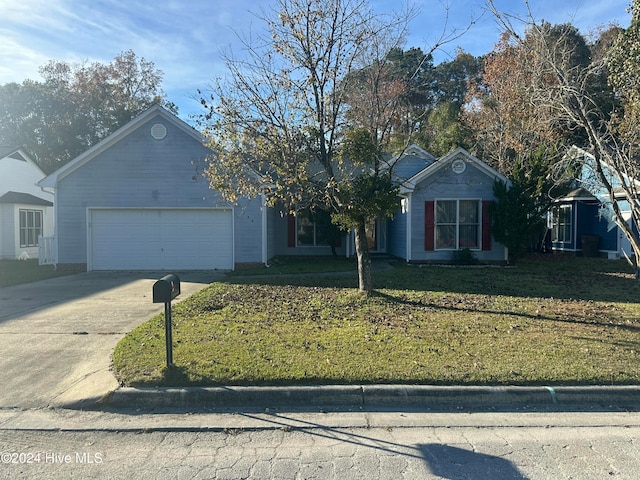 single story home featuring a front lawn and a garage