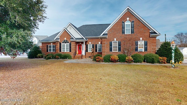 view of property featuring a front lawn