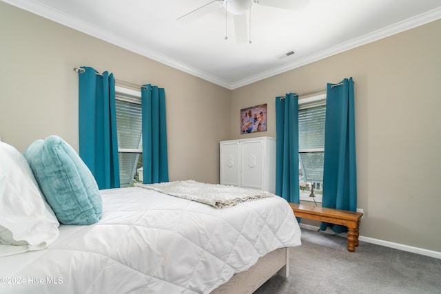 bedroom featuring ceiling fan, carpet floors, and ornamental molding