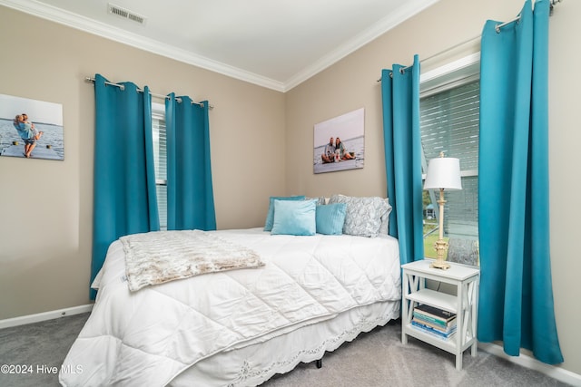 carpeted bedroom featuring ornamental molding