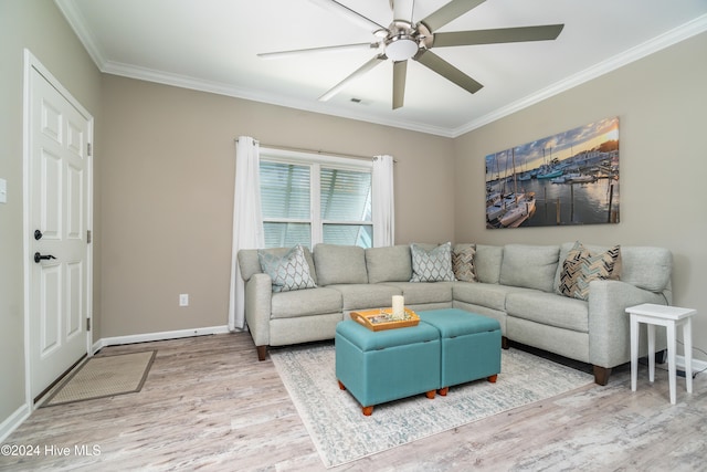 living room with hardwood / wood-style floors, ceiling fan, and ornamental molding