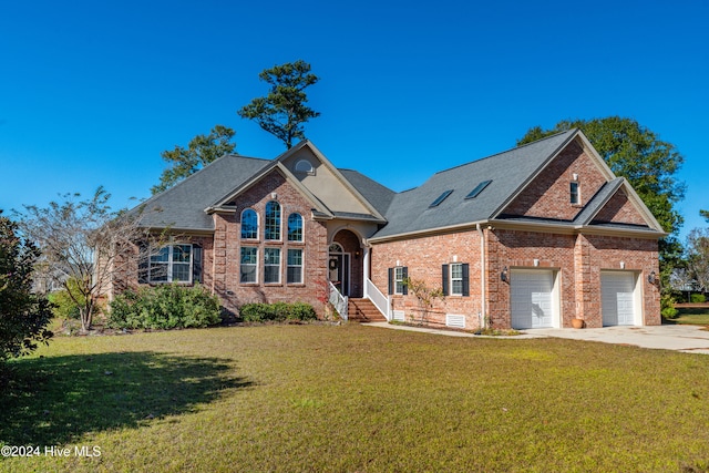 front of property featuring a garage and a front lawn