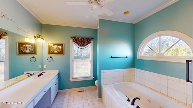 bathroom with vanity, crown molding, tile patterned flooring, toilet, and tiled tub