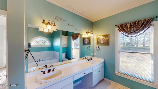 bathroom with vanity, tile patterned floors, crown molding, toilet, and a tub