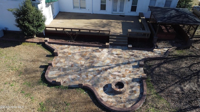 exterior details featuring an outdoor fire pit