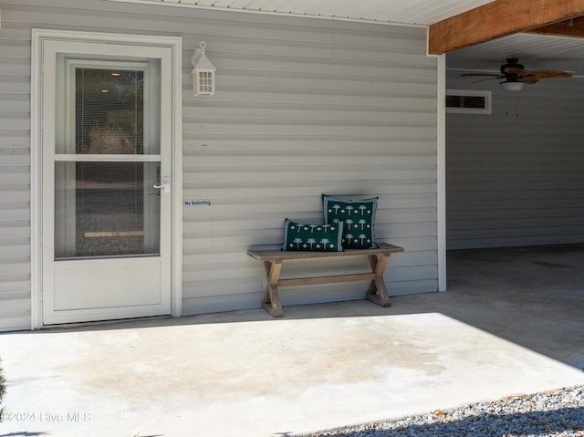 doorway to property with a ceiling fan