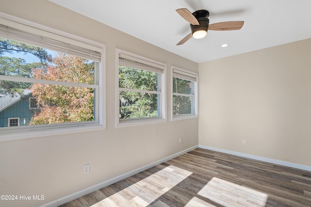 spare room with ceiling fan and hardwood / wood-style floors