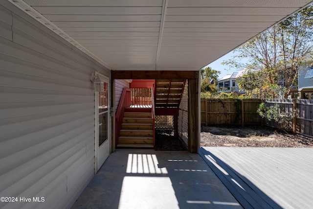 view of patio / terrace featuring fence and a deck