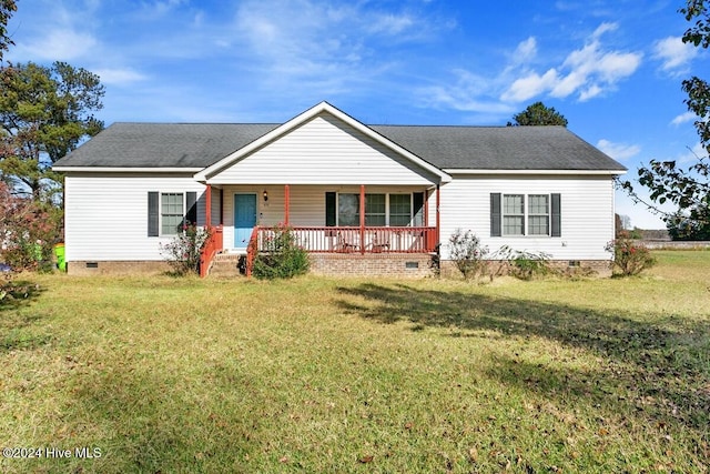 single story home with a porch and a front yard