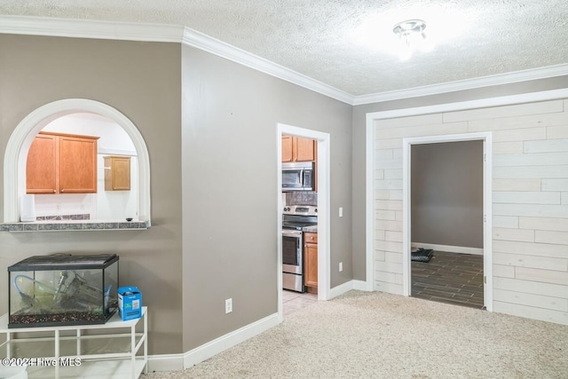 interior space with light carpet, a textured ceiling, and crown molding