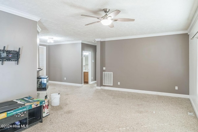 interior space with ceiling fan, a textured ceiling, and ornamental molding