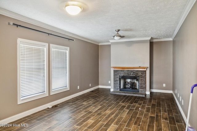 unfurnished living room featuring a fireplace, crown molding, dark hardwood / wood-style flooring, and a textured ceiling