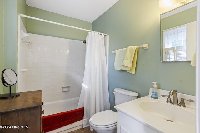 full bathroom with vanity, toilet, and shower / tub combo