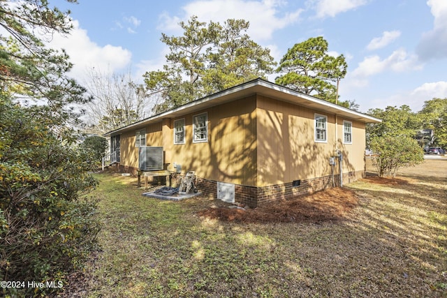 view of property exterior with central AC