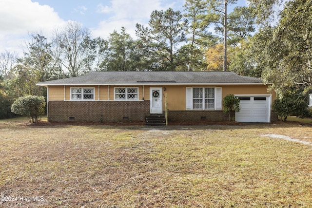 single story home featuring a front yard and a garage