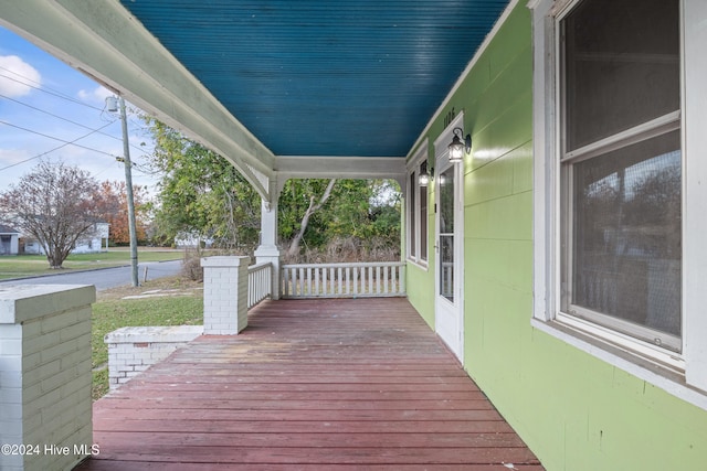 wooden terrace featuring a porch